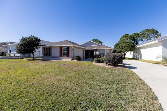 ranch-style home with a front lawn and a garage