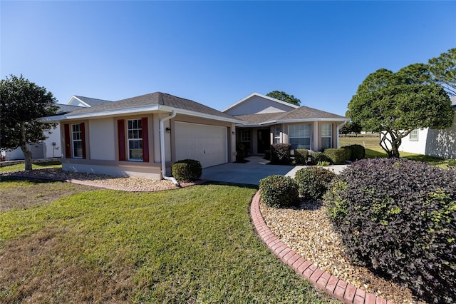 ranch-style house with a garage and a front yard