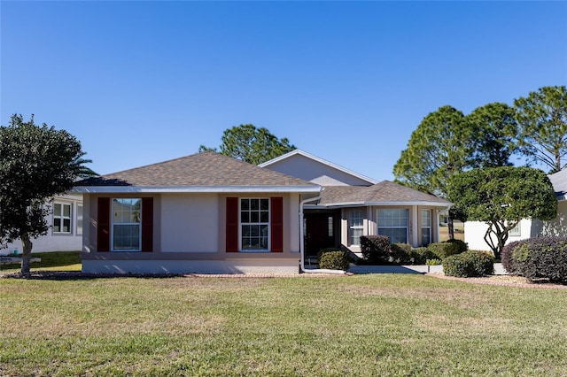 ranch-style house with a front lawn