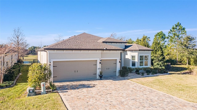 view of front facade with a front lawn and a garage