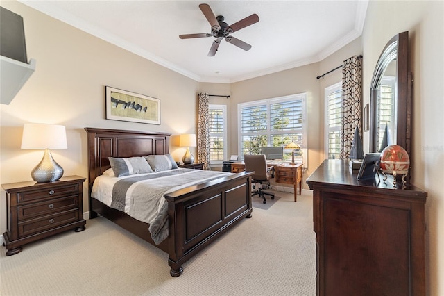 carpeted bedroom featuring ceiling fan and crown molding