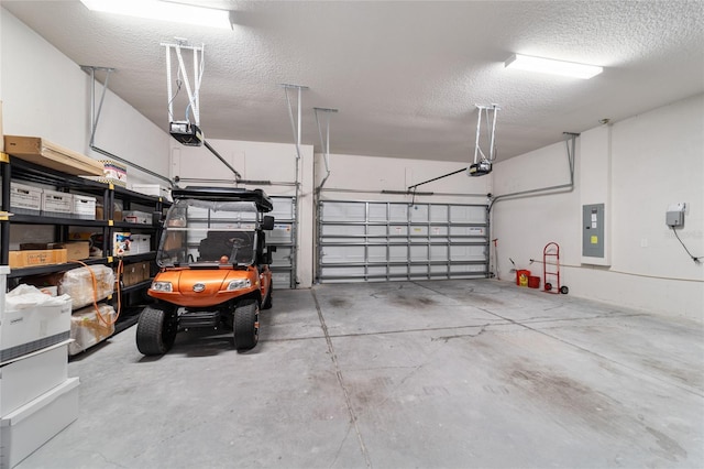 garage featuring electric panel and a garage door opener