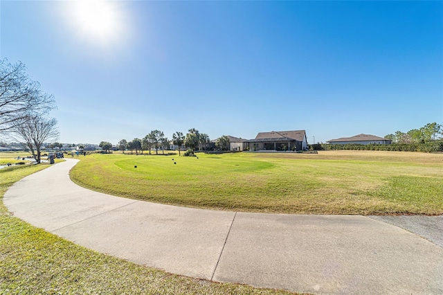 view of property's community with a lawn