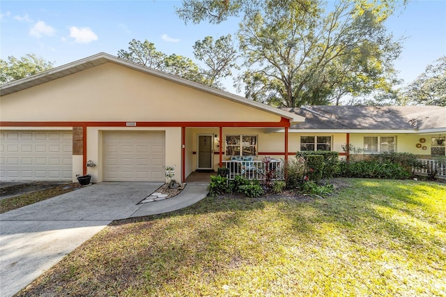 single story home featuring a front lawn, a porch, and a garage