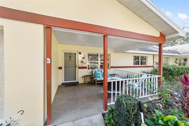 doorway to property with a porch