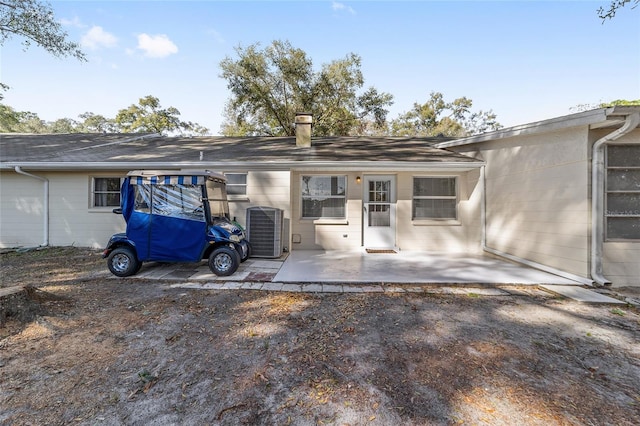 rear view of house featuring a patio and central air condition unit