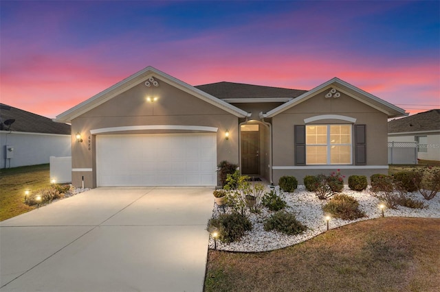 ranch-style home with a garage