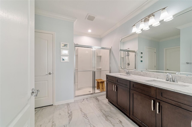 bathroom with vanity, a shower with door, and crown molding