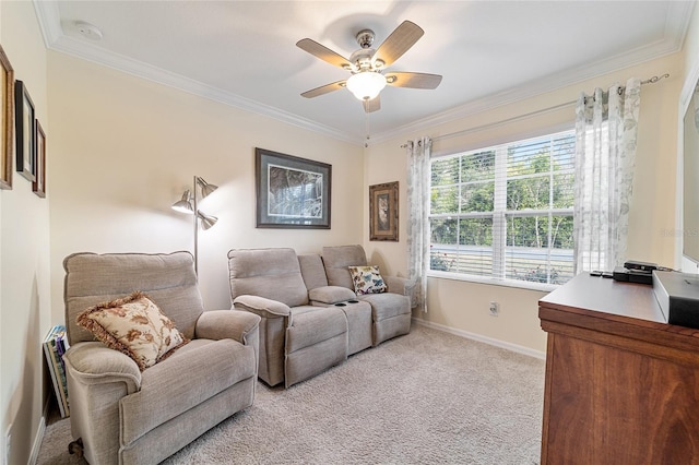 living room with ceiling fan, crown molding, and light colored carpet