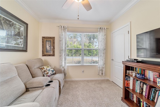 living room featuring light carpet, ceiling fan, and crown molding