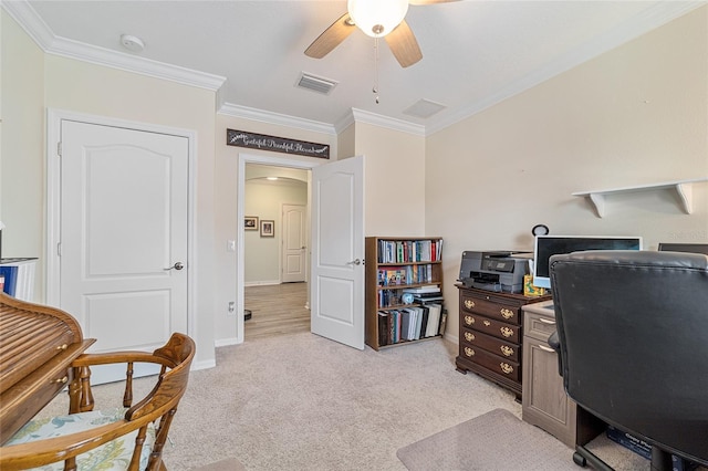 home office featuring ceiling fan, light colored carpet, and ornamental molding