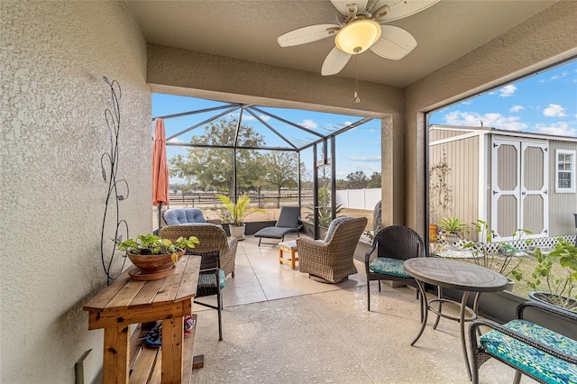 sunroom with ceiling fan and a healthy amount of sunlight