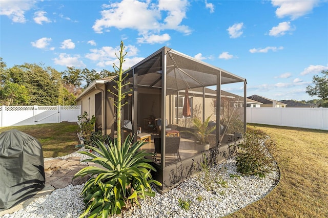 exterior space with a yard, a lanai, and a patio area