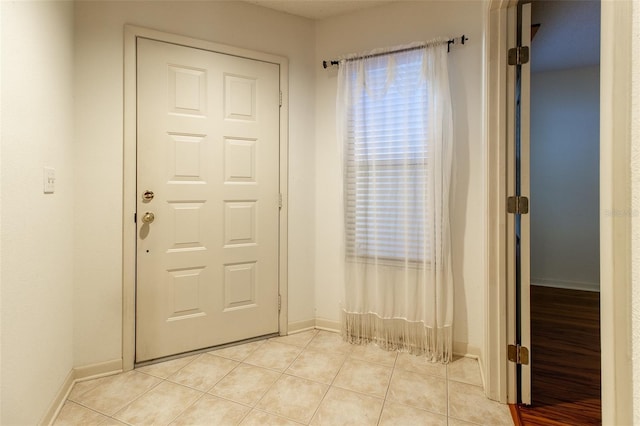 foyer with light tile patterned flooring