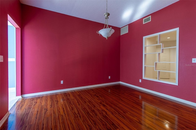 spare room featuring hardwood / wood-style flooring