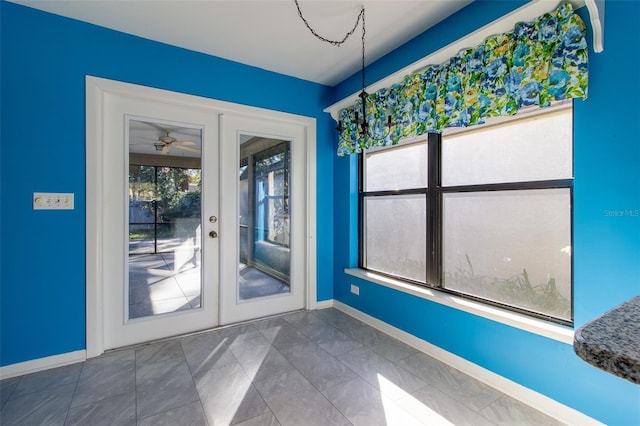 interior space with french doors, ceiling fan, and a healthy amount of sunlight