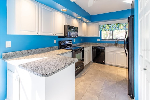 kitchen featuring kitchen peninsula, ceiling fan, sink, black appliances, and white cabinetry