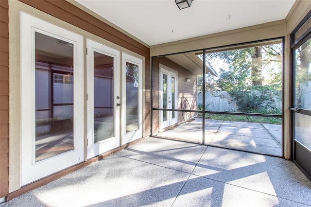 unfurnished sunroom featuring french doors