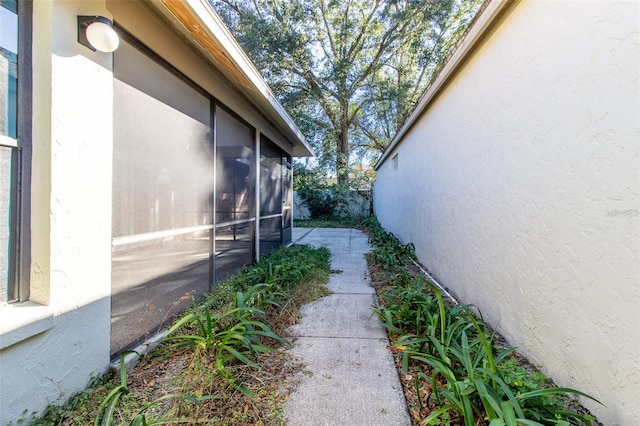 view of side of property with a patio area