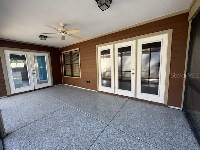 view of patio with french doors and a ceiling fan