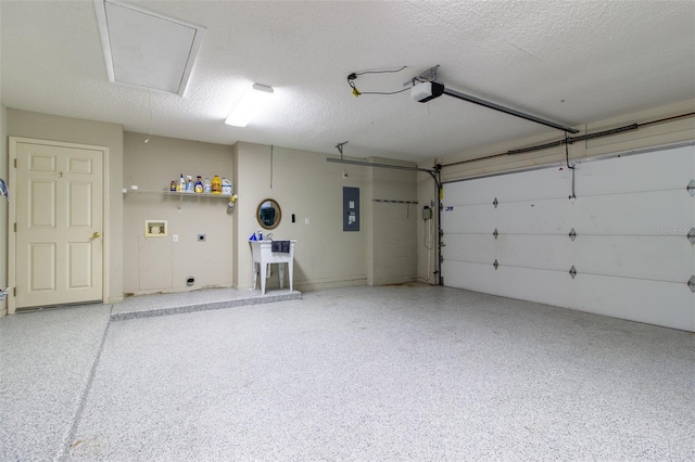 garage with electric panel and a garage door opener