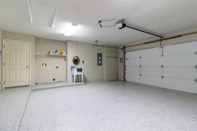 garage featuring electric panel and a garage door opener