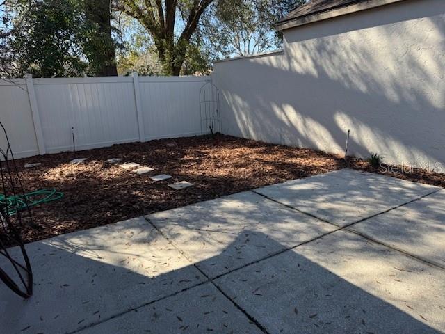 view of yard featuring a patio area and fence private yard