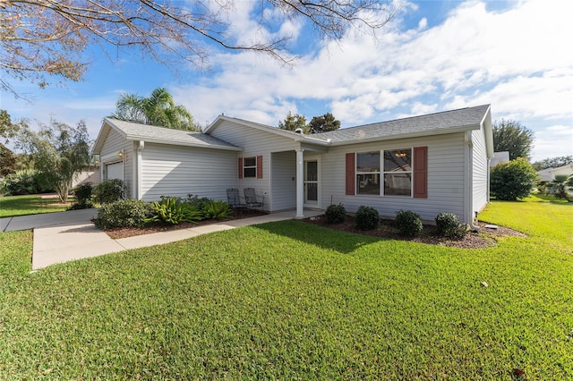 single story home featuring a front yard and a garage