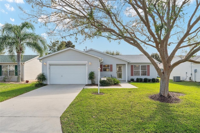 ranch-style house with a front lawn, cooling unit, and a garage