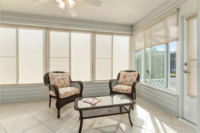 sunroom / solarium featuring ceiling fan