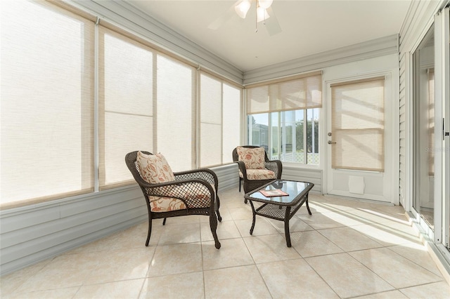 sunroom / solarium featuring ceiling fan