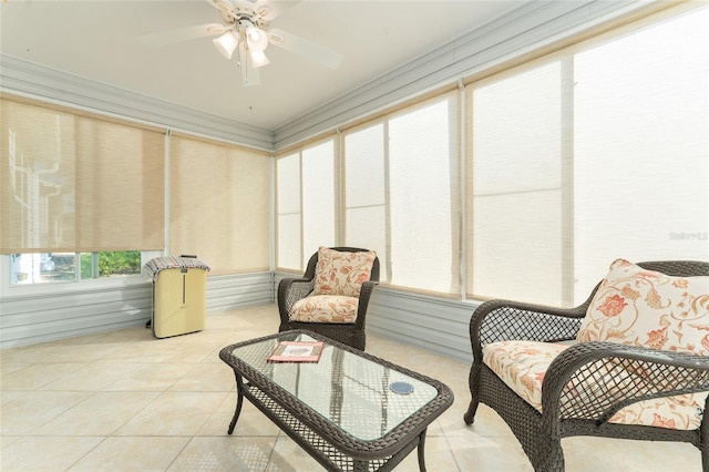 sunroom / solarium featuring ceiling fan