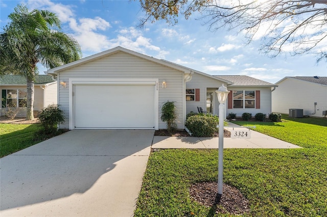 single story home featuring a garage, a front yard, and central AC