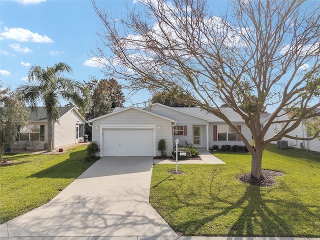 view of front of property with central AC, a front yard, and a garage