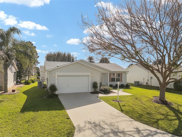 single story home with a front yard, central AC unit, and a garage