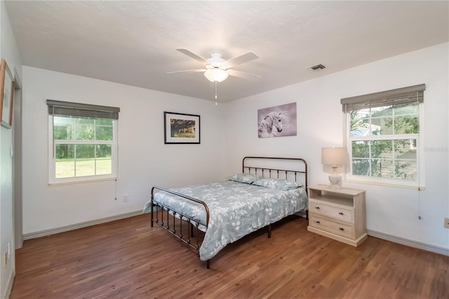 bedroom with hardwood / wood-style flooring and ceiling fan