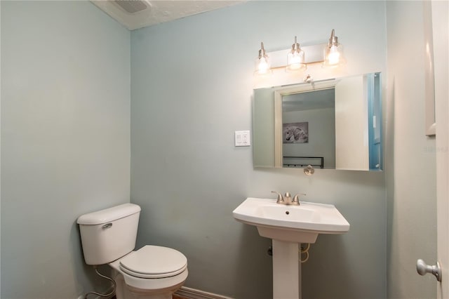 bathroom with toilet and sink