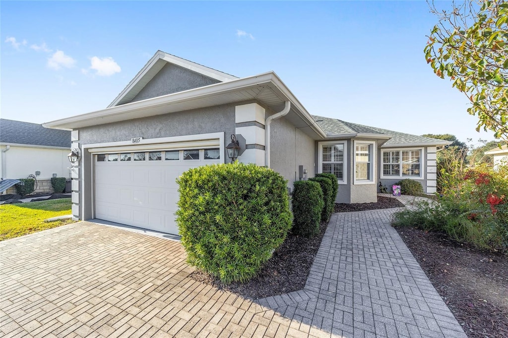 single story home with a garage