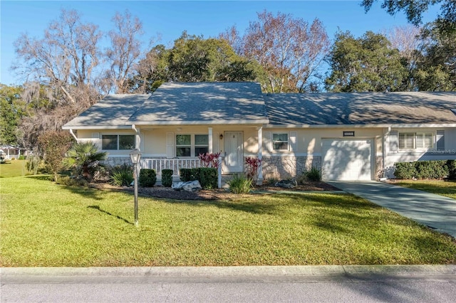 single story home featuring a porch, a garage, and a front yard