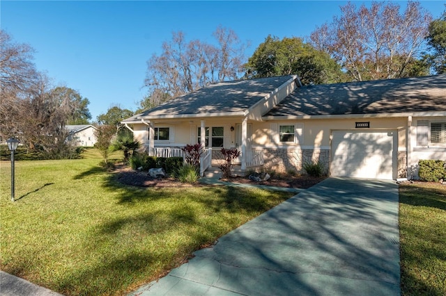 view of front of property featuring covered porch, a garage, and a front yard