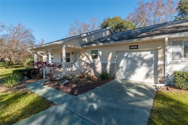 ranch-style home featuring covered porch and a garage