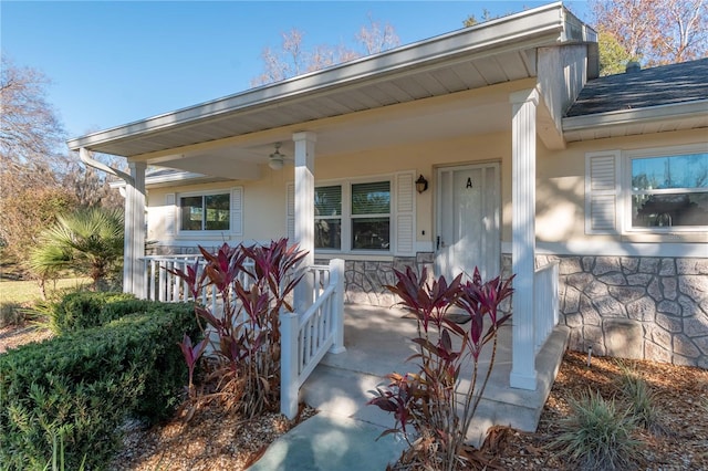 view of exterior entry with a porch