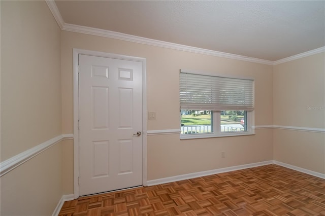 spare room featuring crown molding and light parquet floors