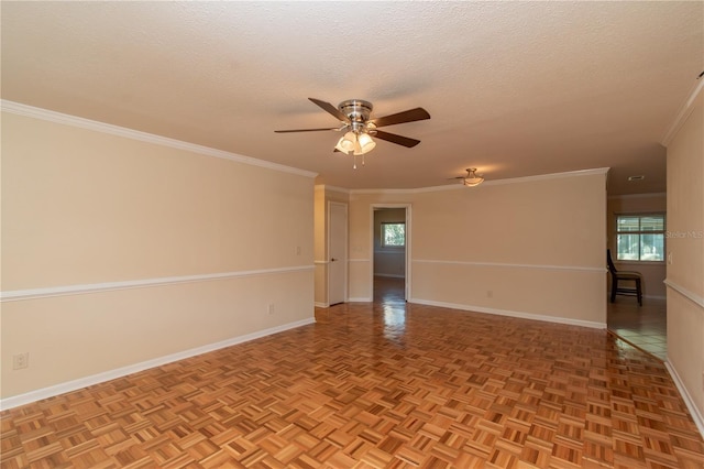 spare room with a textured ceiling, ceiling fan, crown molding, and light parquet flooring