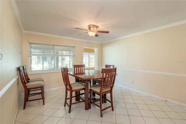 dining room featuring light tile patterned floors, ceiling fan, and ornamental molding