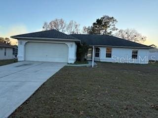 single story home featuring a garage