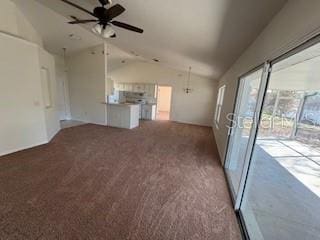 unfurnished living room featuring carpet, ceiling fan, and vaulted ceiling