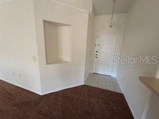 hallway with carpet floors