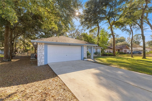 view of front of house featuring a front yard and a garage