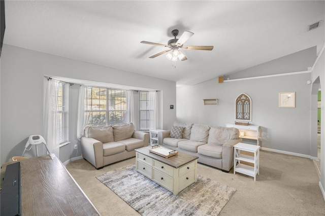 carpeted living room featuring ceiling fan and vaulted ceiling